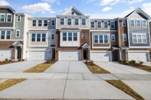 Exterior of a row of townhomes with driveways in Old Northeast