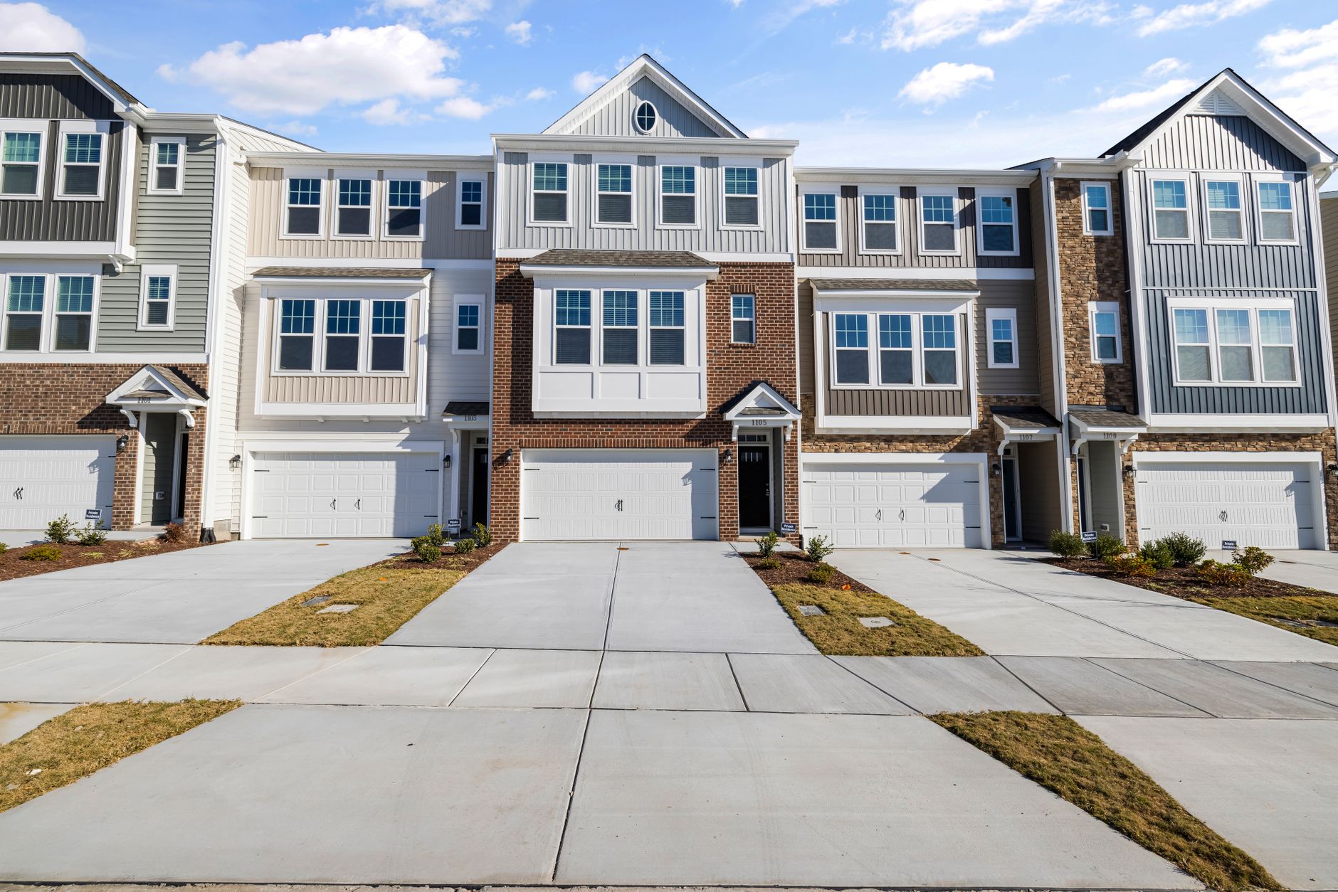 Exterior of a row of townhomes with driveways in Old Northeast