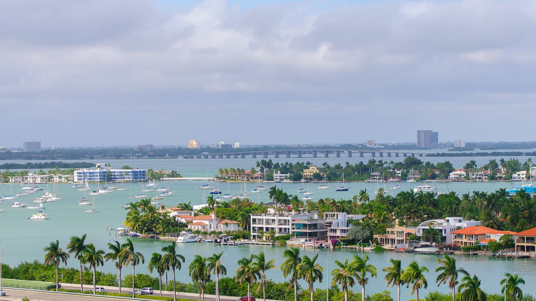 Coastal waterfront with palm trees and sailboats near Gulfport